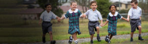 St-Anthony-Padua-Austral-students running in the school yard