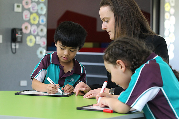 St-Anthony-of-Padua-Austral-students and teacher writing